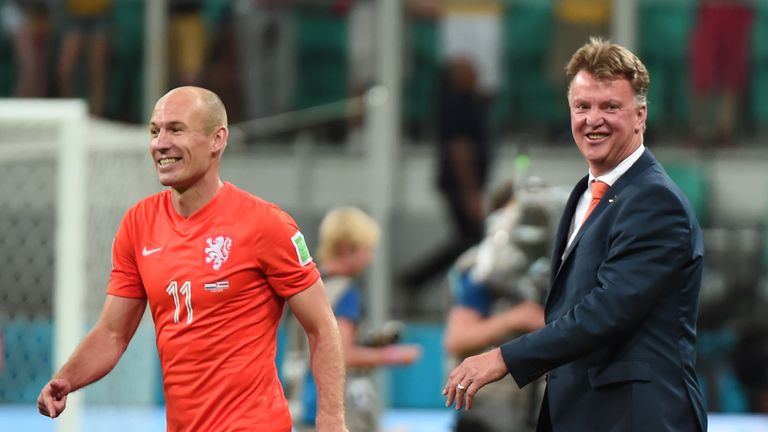 Louis van Gaal celebrates with Arjen Robben after the penalty shootout quarter-final football match between Netherlands and Costa Rica