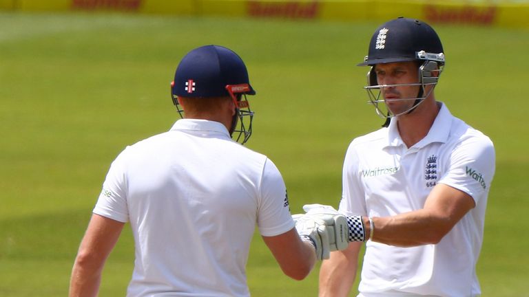 Nick Compton (r) and Jonny Bairstow celebrate the 200 runs total during the day 2 of the 1st test match between South Africa and England, Durban