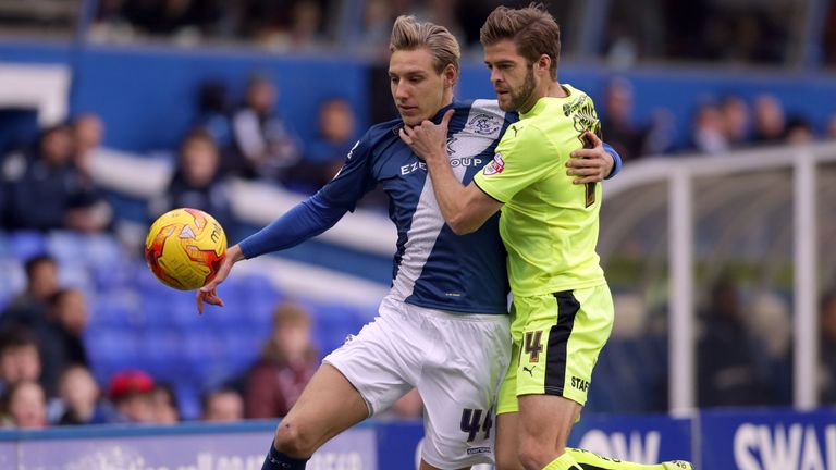 Birmingham City's Nicolai Brock-Madsen (left) and  Huddersfield's Martin Cranie battle for the ball.