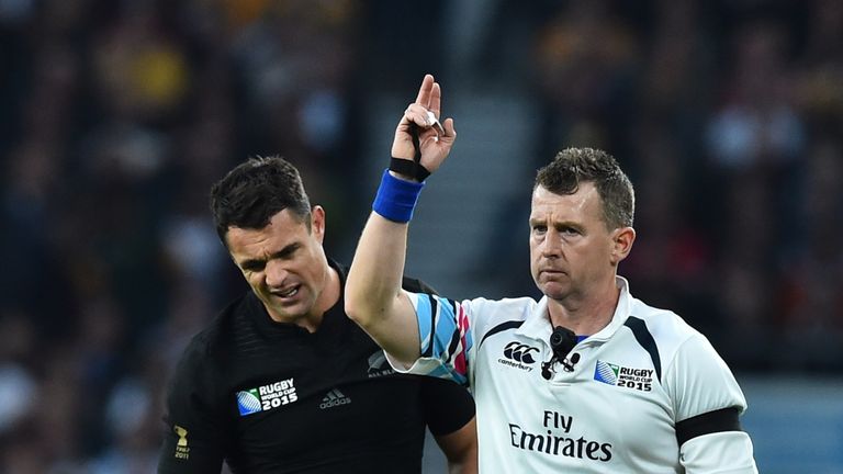 Welsh referee Nigel Owens (right) signals a shot at goal for All Blacks' Dan Carter