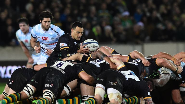 Northampton's Kahn Fotuali'i places the ball in the scrum during the Champions Cup rugby union match between Northampton Saints and Racing Metro 92