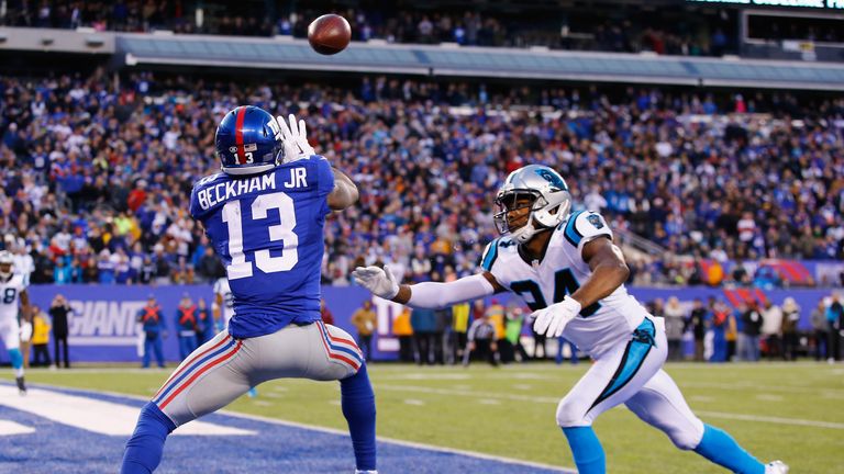 Odell Beckham #13 of the New York Giants scores a game tying touchdown against Josh Norman #24 of the Carolina Panthers