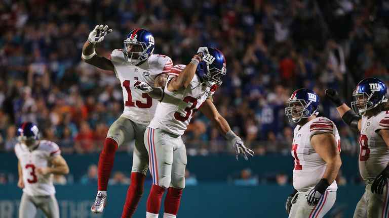 MIAMI GARDENS, FL - DECEMBER 14:  Odell Beckham #13 celebrates with Shane Vereen #34 of the New York Giants after scoring a touchdown during the third quar