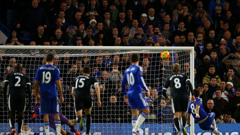 Oscar watches the ball fly over the bar as he slips taking a penalty