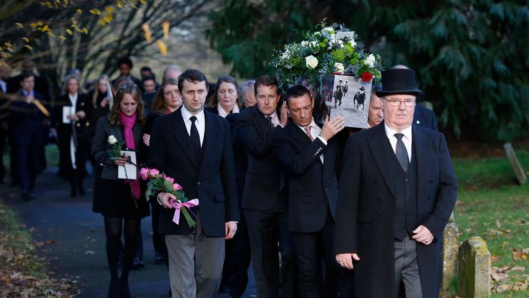 Frankie Dettori and other jockey's carry out the coffin after the Funeral Service for Pat Eddery held at St Mary the Virgin Church, Thame