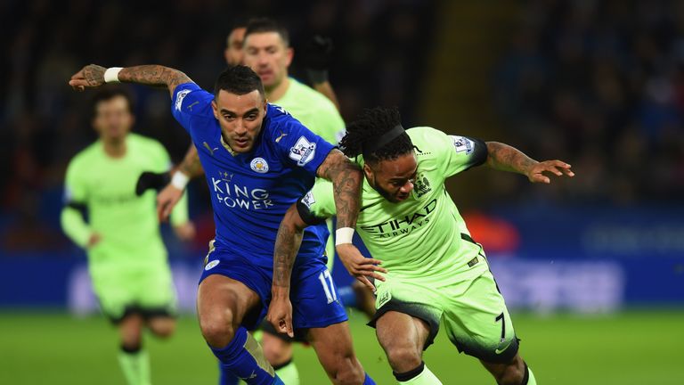 Raheem Sterling of Manchester City battles with Danny Simpson of Leicester City