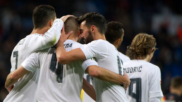 Karim Benzema celebrates with teammates after scoring during the Spanish league football match Real Madrid CF vs Rayo Vallecano de Madrid at the Bernabeu