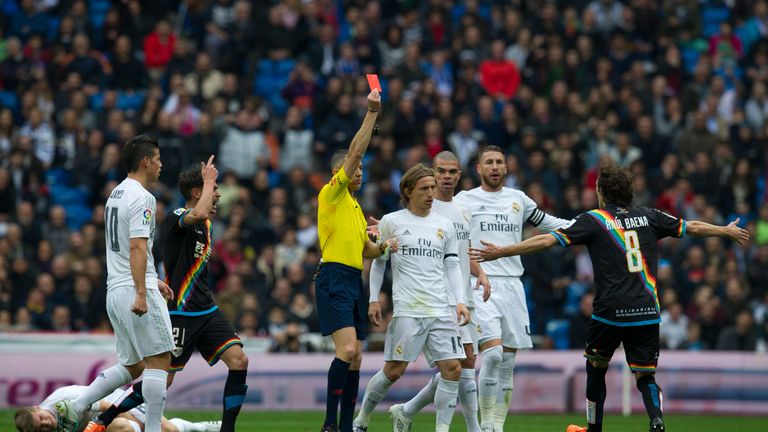 The referee shows a red card to Rayo Vallecano's midfielder Jose Raul Baena match Real Madrid Rayo Vallecano at the Santiago Bernabeu stadium in Madrid
