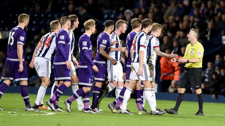 Jonathan Moss is confronted by players from both sides during the Barclays Premier League match between West Bromwich Albion and Tottenham