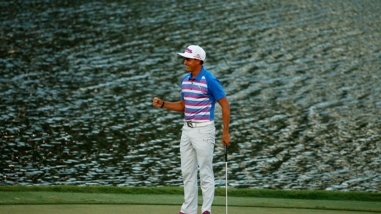 Rickie Fowler celebrates as he wins the playoff in the final round of THE PLAYERS Championship at the TPC Sawgrass Stadium