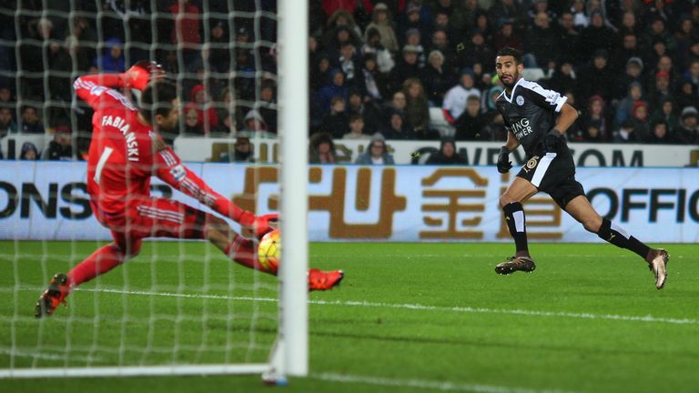 Riyad Mahrez of Leicester City scores his team's third and hat trick goal against Swansea