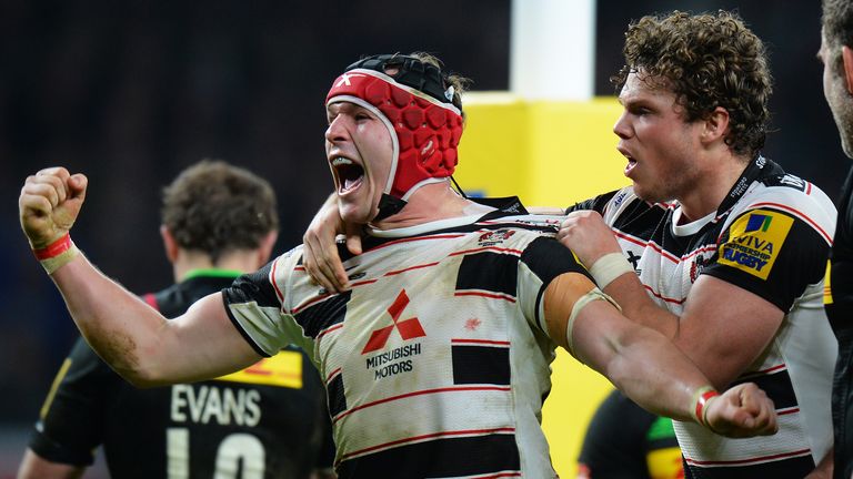 Rob Cook of Gloucester celebrates scoring his team's fifth try 