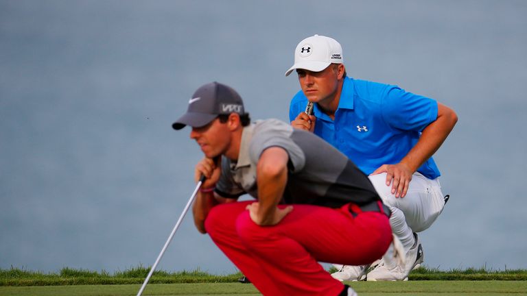 SHEBOYGAN, WI - AUGUST 13:  Rory McIlroy of Northern Ireland and Jordan Spieth of the United States look over a green during the first round of the 2015 PG