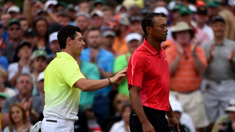 Rory McIlroy and Tiger Woods in action during the final round of the Masters
