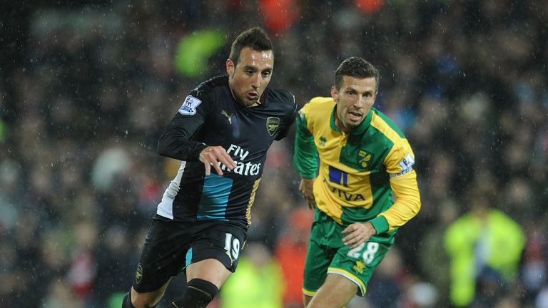 Arsenal's Santi Cazorla injured his knee in a collision with norwich midfielder Gary O'Neil
