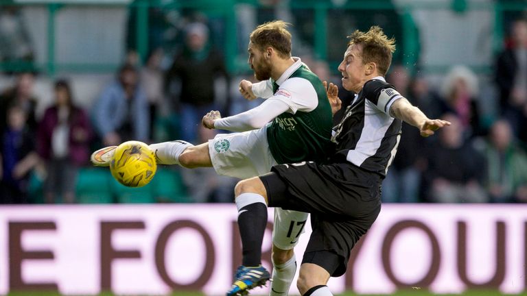 Hibernian's Martin Boyle tries to get the better of Chris Higgins but Queen of the South remained firm at Easter Road