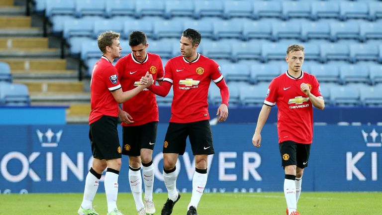 Goss is congratulated by Robin Van Persie after scoring against Leicester