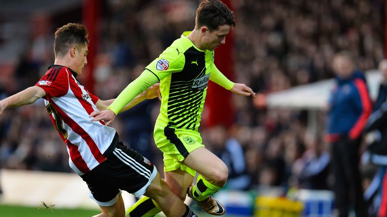 Sergi Canos of Brentford and Ben Chilwell of Huddersfield Town in action