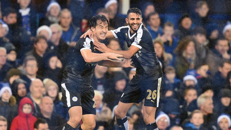 Shinji Okazaki (L) of Leicester City celebrates scoring his team's third goal with his team mate Riyad Mahrez (R) 