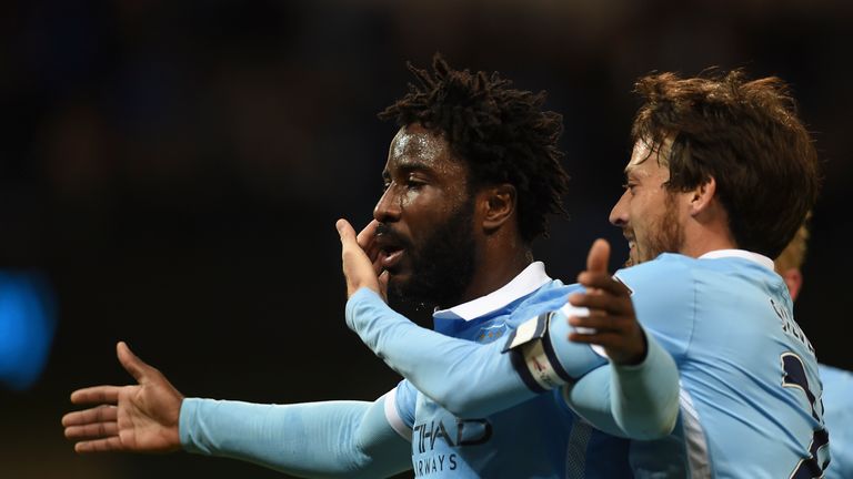 Manchester City's Ivorian striker Wilfried Bony (L) celebrates with David Silva (R)