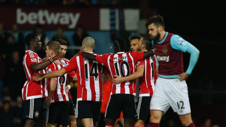 Southampton's Serbian midfielder Dusan Tadic (2nd R) celebrates opening goal during the English Premier League football match between West Ham United 