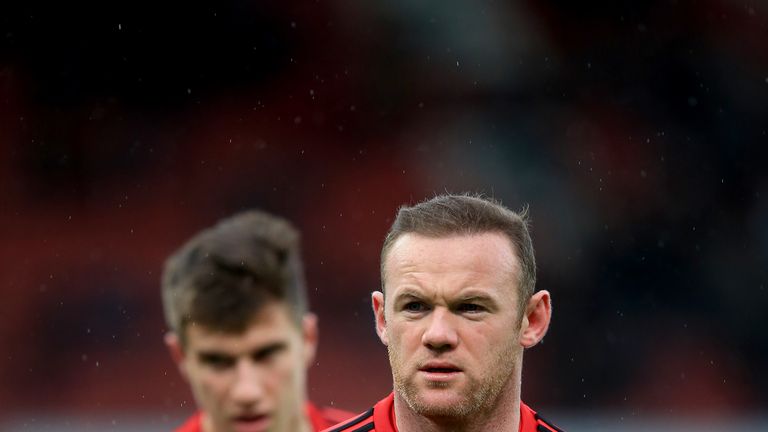 Manchester United's Wayne Rooney warms up before the Barclays Premier League match at the Britannia Stadium, Stoke