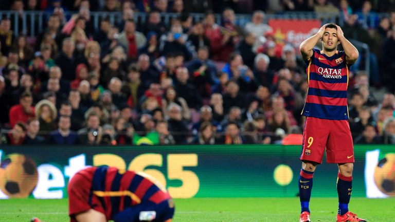 Lionel Messi (L) and Luis Suarez (R) dejected after draw