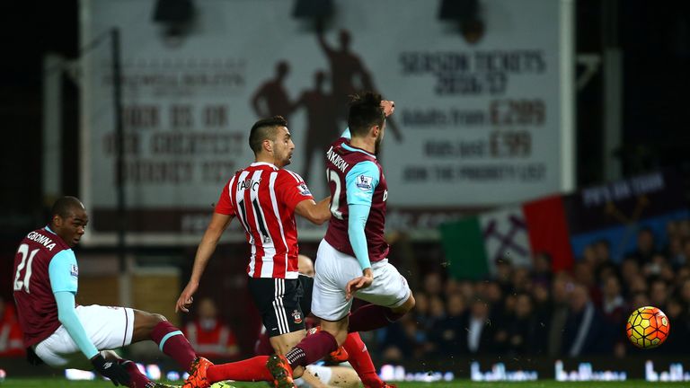 Dusan Tadic of Southampton scores his side's first goal during the Barclays Premier League match between West Ham United and Southampton 