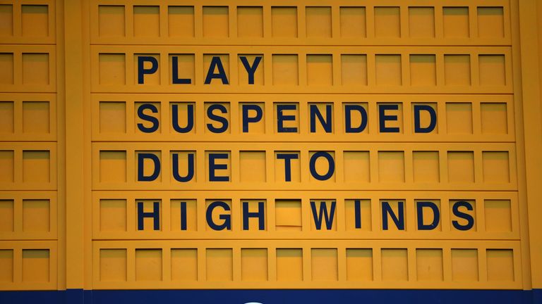 A scoreboard displays that play is suspended due to high winds during the second round of the 144th Open Championship 