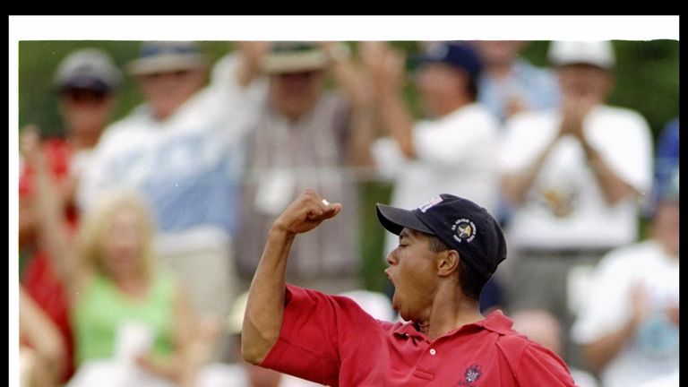 Tiger Woods celebrates after scoring an eagle during the U.S. Amateur Championships at the Pumpkin Ridge Golf Course in Cornelius, Oregon.