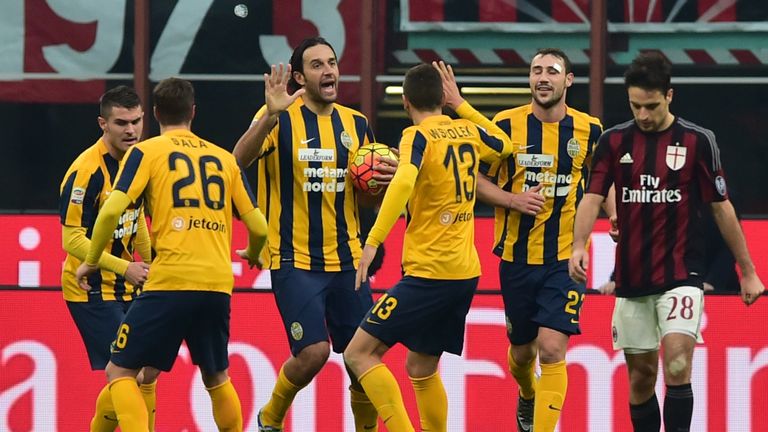 Luca Toni (c) celebrates scoring from the spot against AC Milan