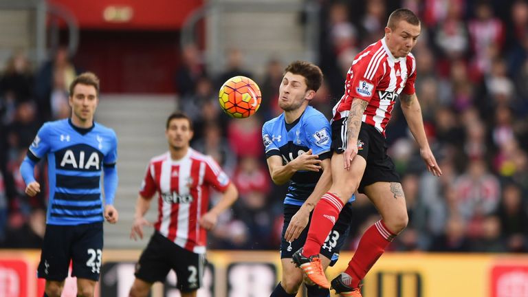 Southampton's Jordy Clasie outjumps Ben Davies of Tottenham