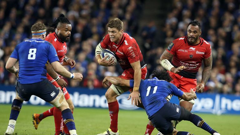 Toulon's flankerJuan Smith (C) is tackled by Leinster's wing Isakeli Nacewa during the Champions Cup rugby union match between Leinster and Toulon
