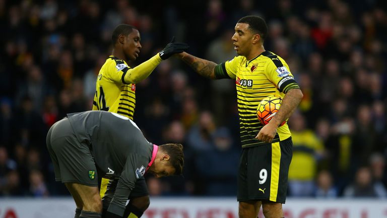 Odion Ighalo congratulates Troy Deeney (R) for scoring a penalty during the Barclays Premier League match between Watford and Norwich City