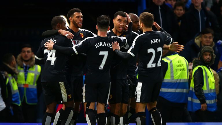 Troy Deeney celebrates with team-mates after converting Watford's equaliser from the penalty spot