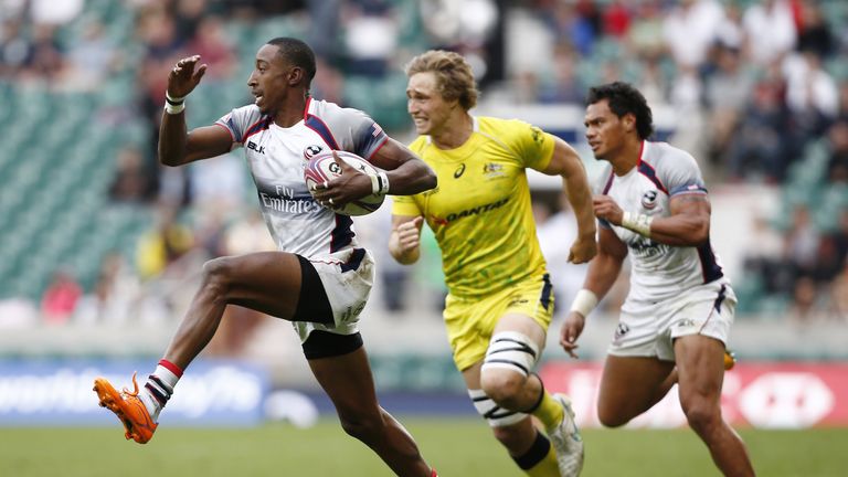 US's Perry Baker runs past Australia's Greg Jeloudev during the London Sevens final match between USA and Australia, part of the IRB Sevens World Series