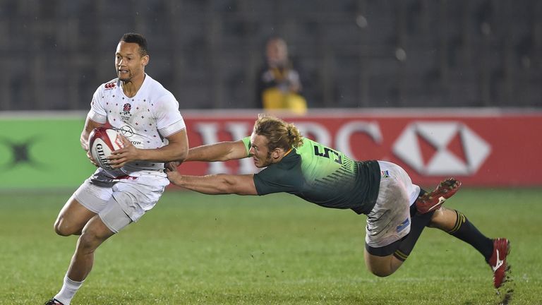 England's Dan Norton dodges a tackle by South Africa's Werner Kok