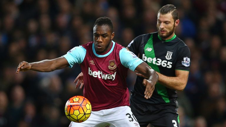 LONDON, ENGLAND - DECEMBER 12: Michail Antonio of West Ham United controls the ball under pressure of Erik Pieters of Stoke City during the Barclays Premie