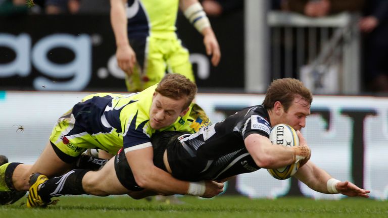 EXETER, ENGLAND - DECEMBER 26: Will Chudley of Exeter Chiefs avoids Mike Haley of the Sale Sharks as he scores a try during the Exeter Chiefs v Sale sharks