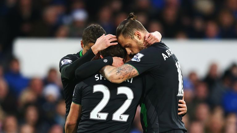 Xherdan Shaqiri (C) celebrates scoring Stoke's first goal against Everton with his team mates Ibrahim Afellay (L)  and Marko Arnautovic (R)
