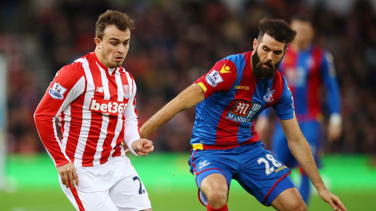 Xherdan Shaqiri of Stoke City and Joe Ledley of Crystal Palace compete for the ball