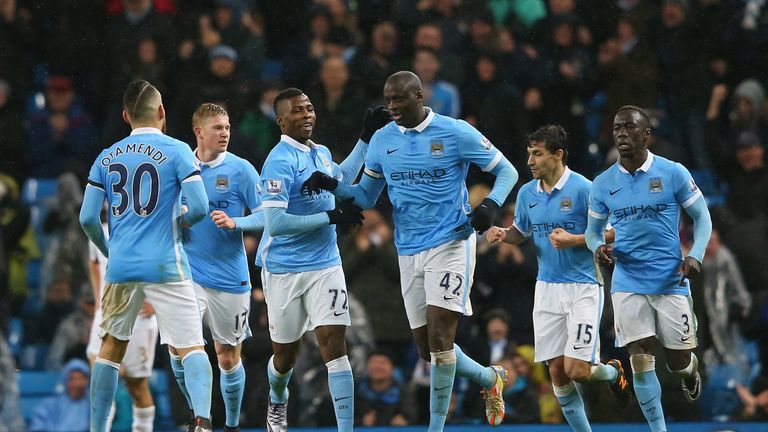 Yaya Toure celebrates scoring his team's second goal with his team mates during the Barclays Premier League match between Manchester City and Swansea City