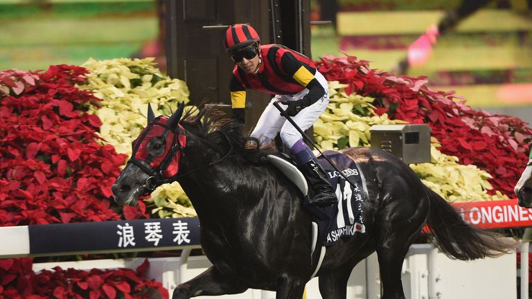 HONG KONG - DECEMBER 13:  Yutake Take riding A Shin Hikari from Japan wins the Longines Hong Kong Cup.