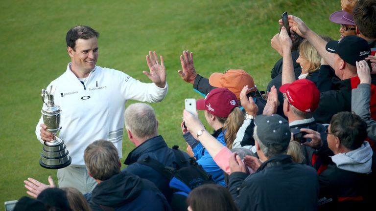 ST ANDREWS, SCOTLAND - JULY 20:  Zach Johnson of the United States holds the Claret Jug and celebrates with fans after winning the 144th Open Championship 