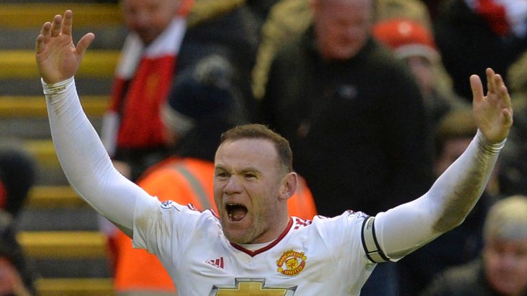 Wayne Rooney celebrates after scoring the winner at Anfield