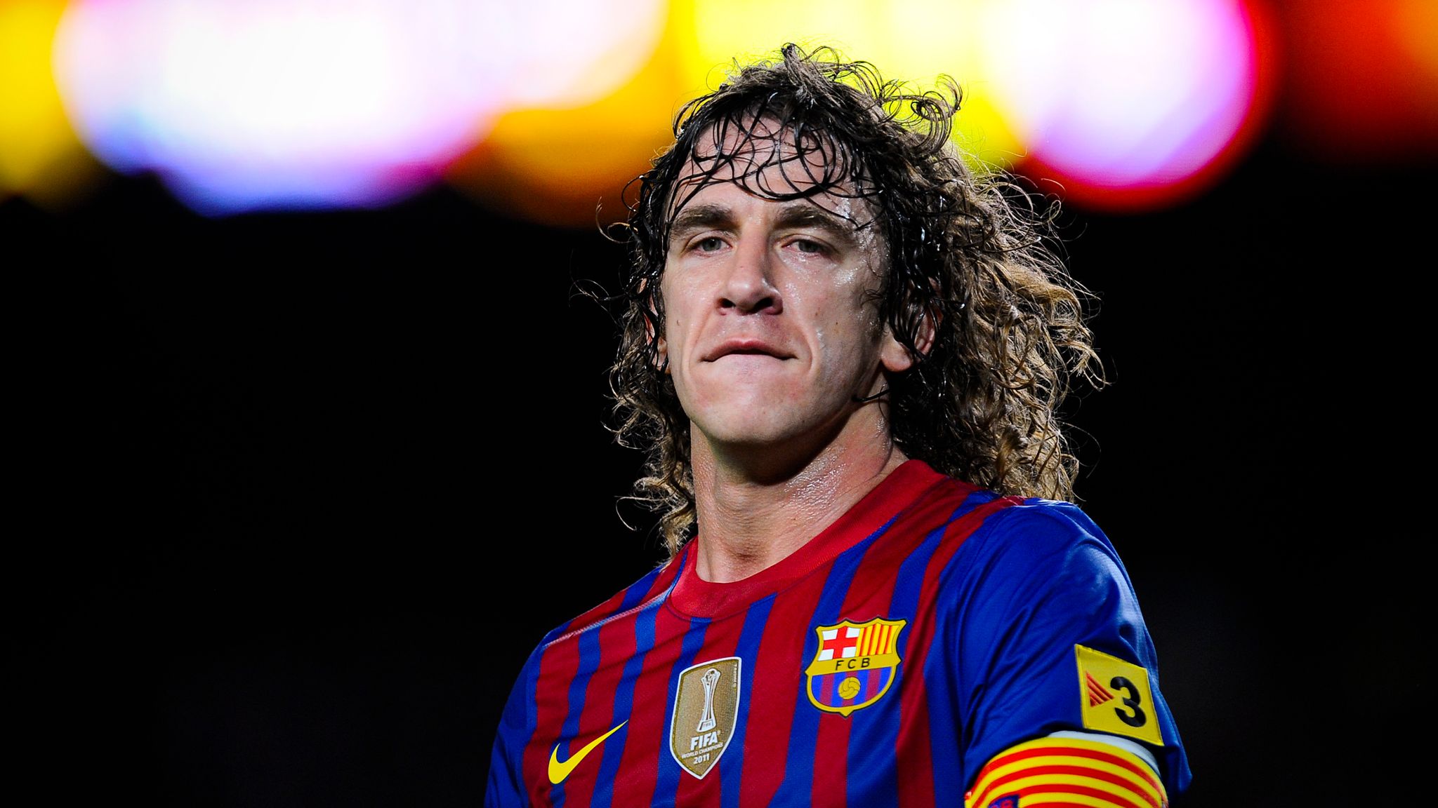  Carles Puyol, a Spanish professional footballer who played as a centre back for Barcelona and the Spain national team, is seen here captaining FC Barcelona.