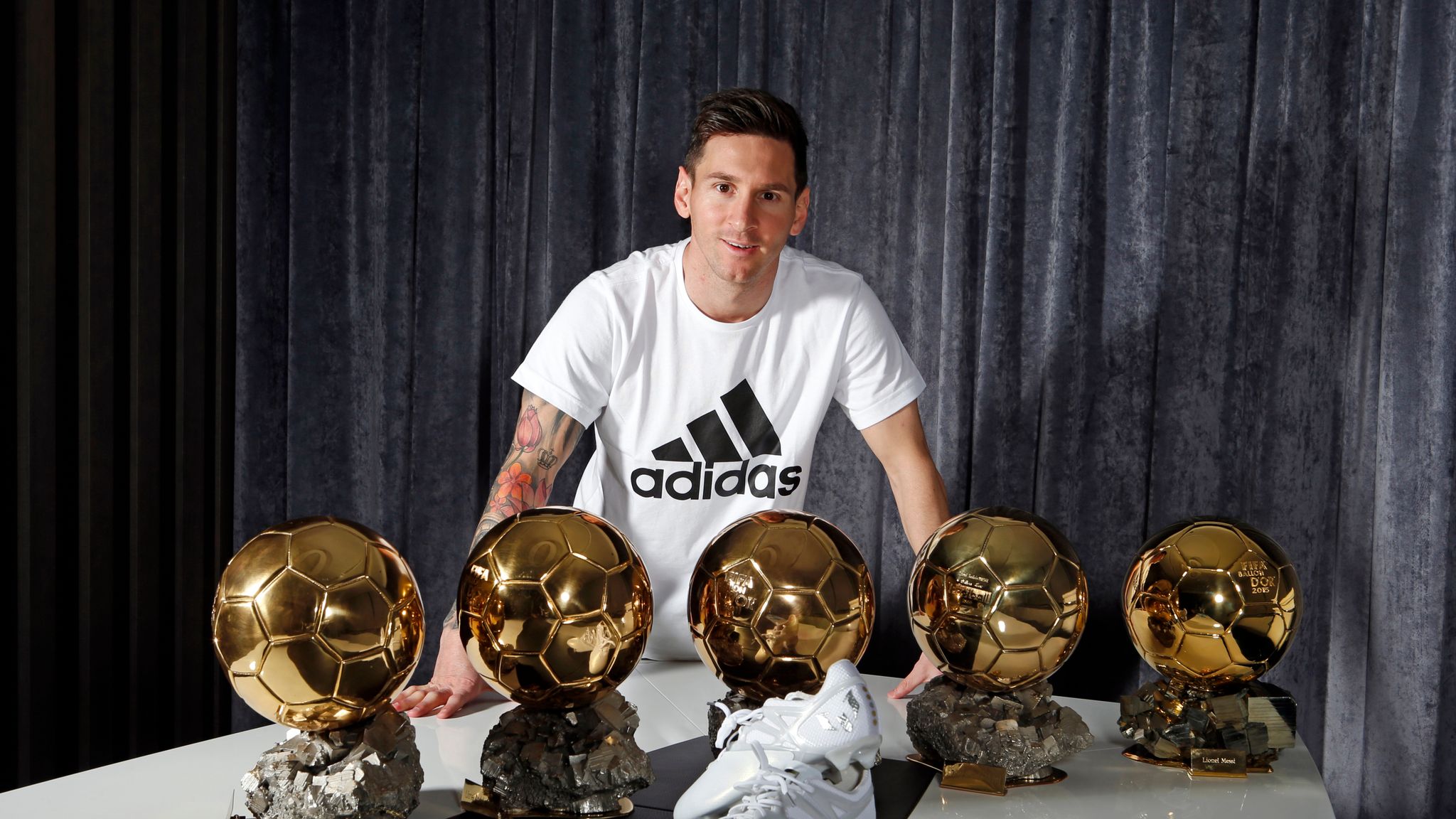 Fivetime Ballon d'Or winner Lionel Messi receives platinum boot from