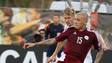 Image of Deniss Rakels (front) in action for Latvia