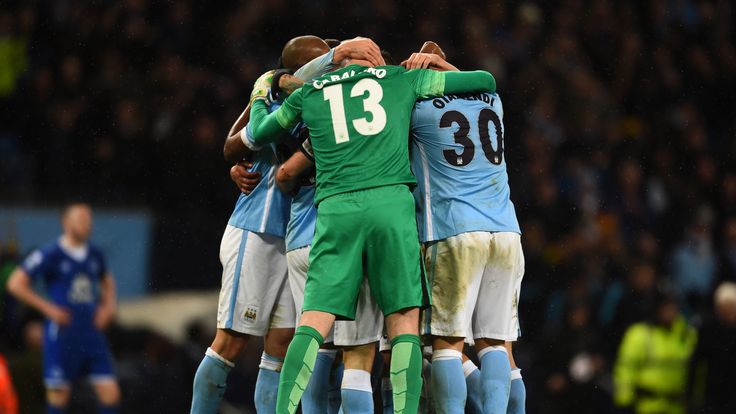 Manchester City teammates celebrate their team's 3-1 victory and progression to the final during the Capital One Cup Semi Final, second leg