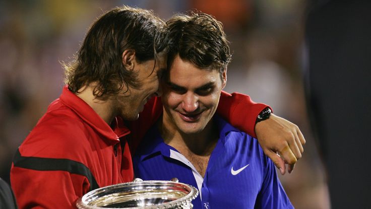 2009: Rafael Nadal of Spain consoles Roger Federer of Switzerland during the trophy presentation after his men's final match